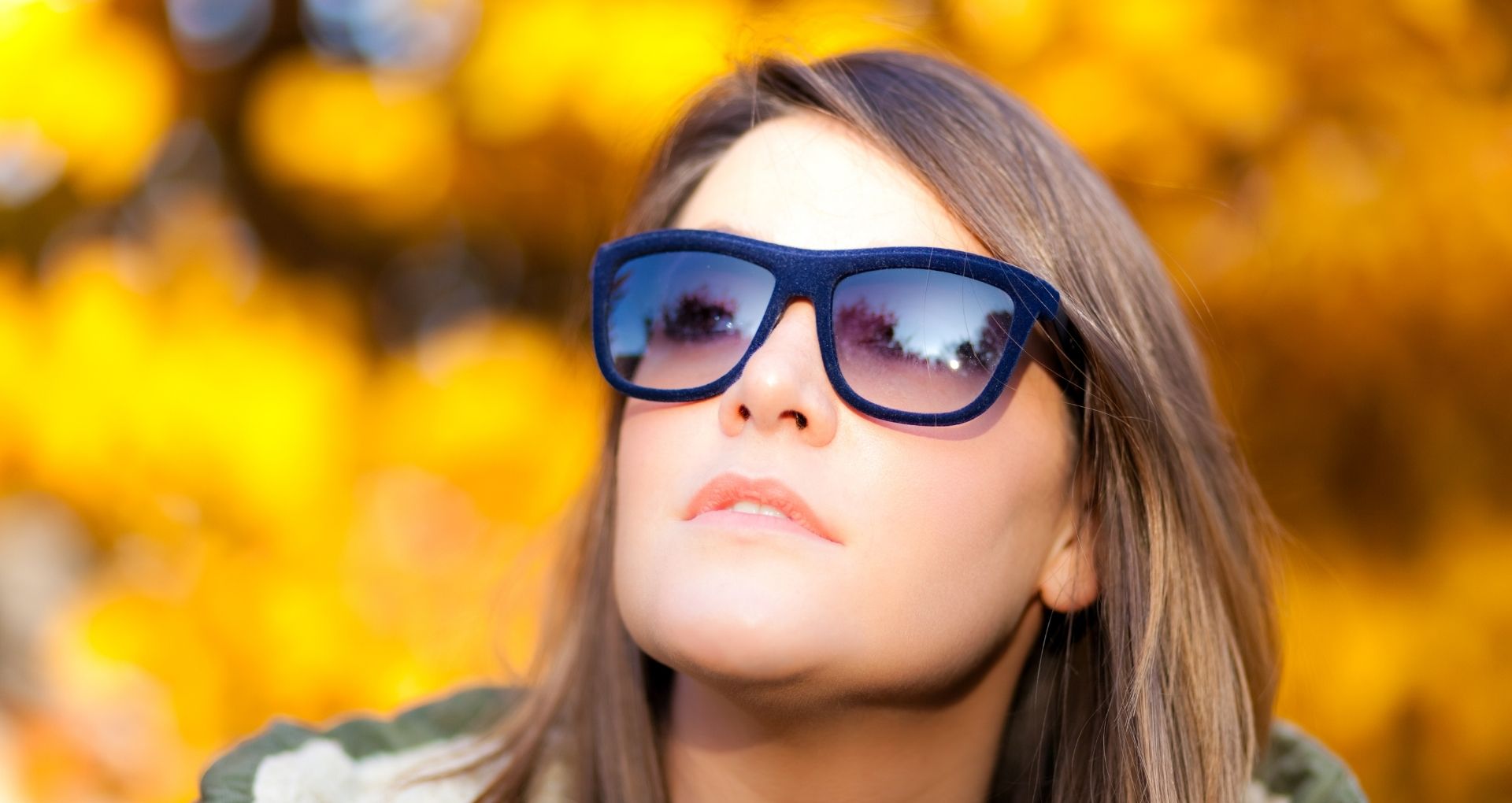  Woman wearing sunglasses to protect her eyes in the fall season to help protect against allergens